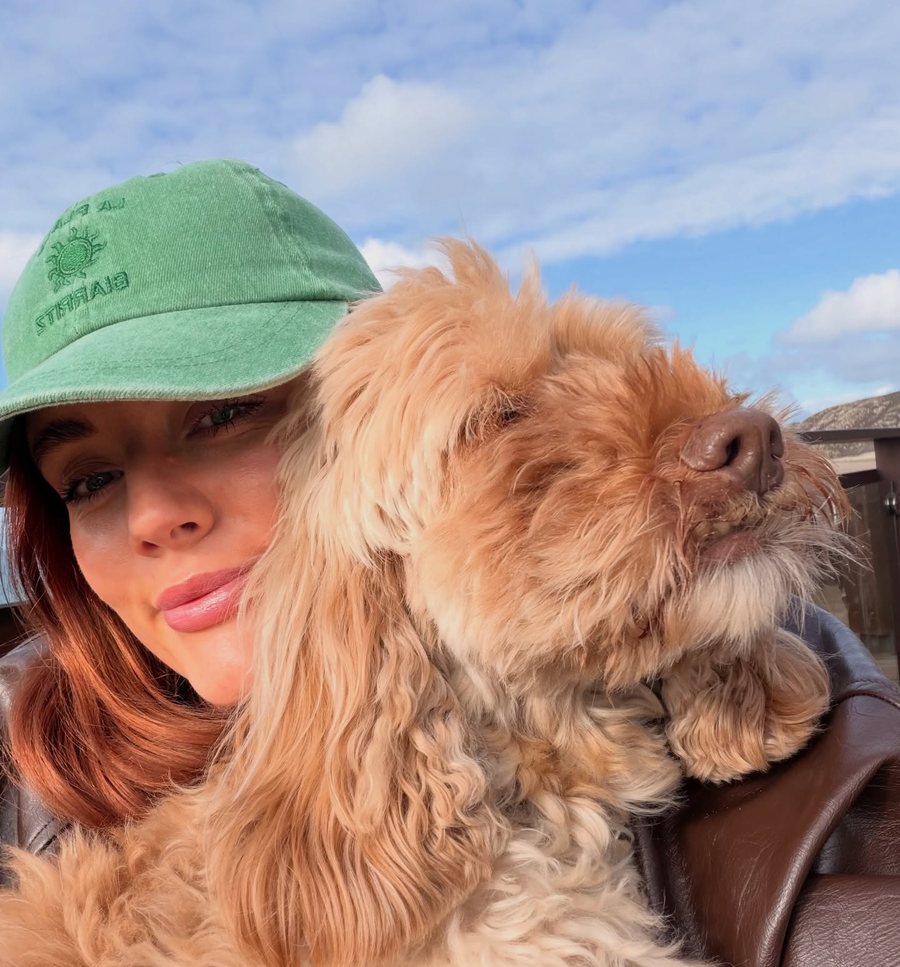 Ella from Tatton Dog Walkers with a happy dog in Knutsford
